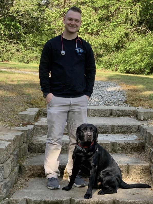 Carson, Veterinary Technician, with his friend "Cole"